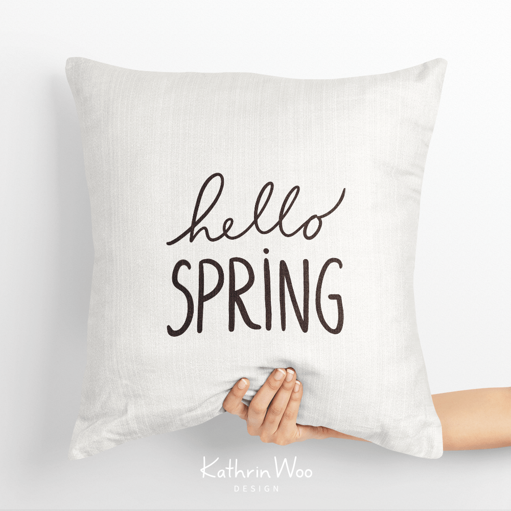 Playful Tulip Hand Lettering Design Hello Spring by Kathrin Woo on a pillow