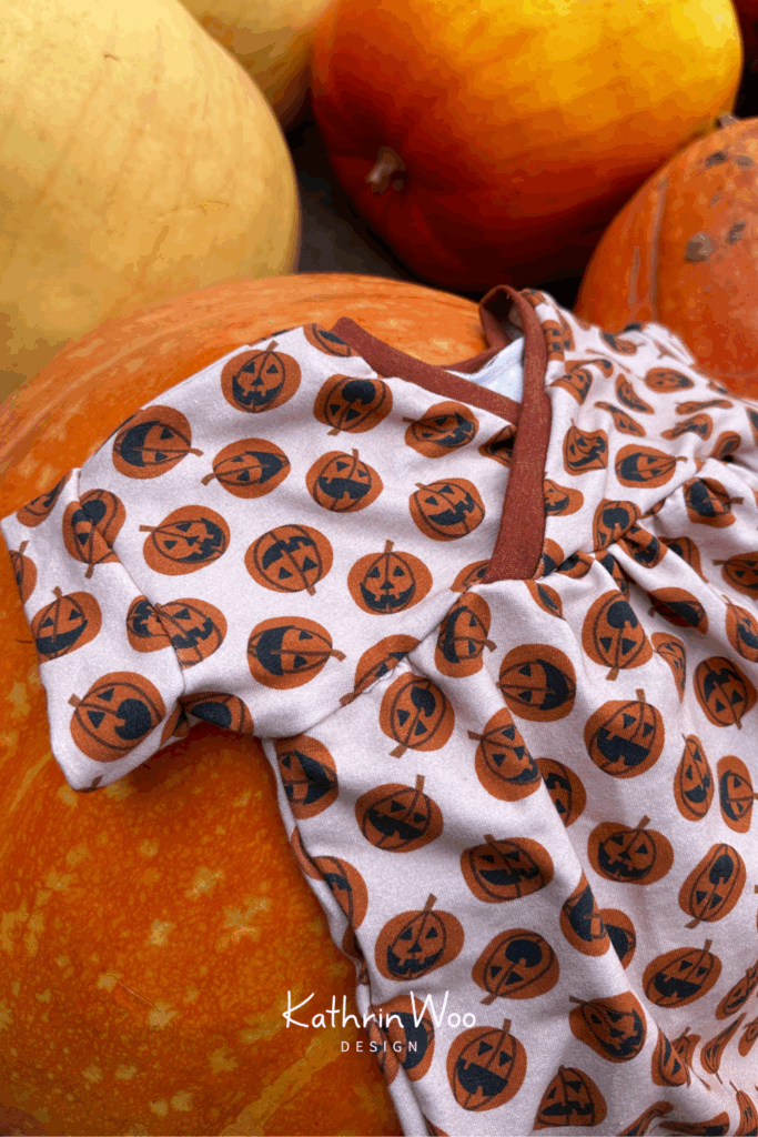 Cute Baby Halloween Jumpsuit with surface pattern designs Pumpkin Polkadot from Kathrin Woo's Halloween Collection Spooky Season made with fabric from Lillestoff