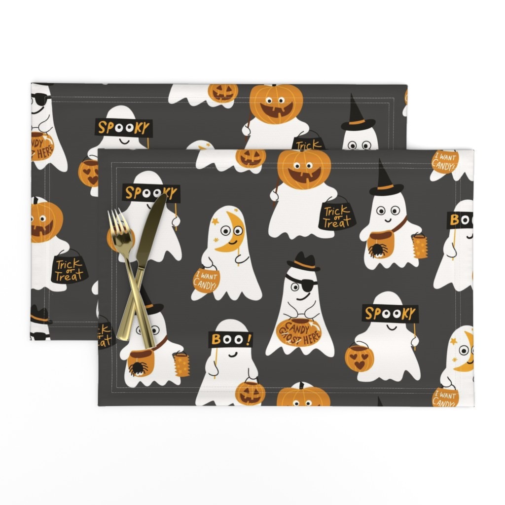 Cute and playful surface pattern design Cheeky Ghosts from Kathrin Woo's Halloween Collection Spooky Season displayed on Spoonflower table placemats.