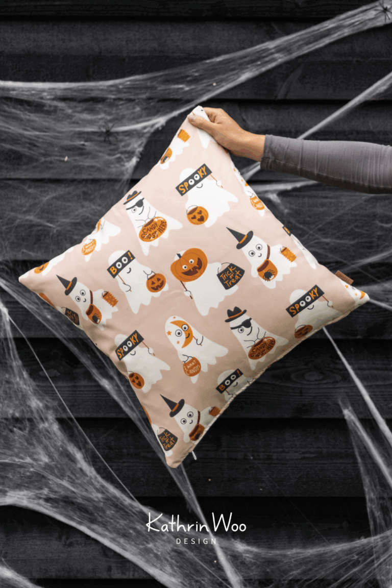 Surface Pattern Design Cheeky Halloween ghosts on a trick or treat hunt by Kathrin Woo showcased on a pillow case