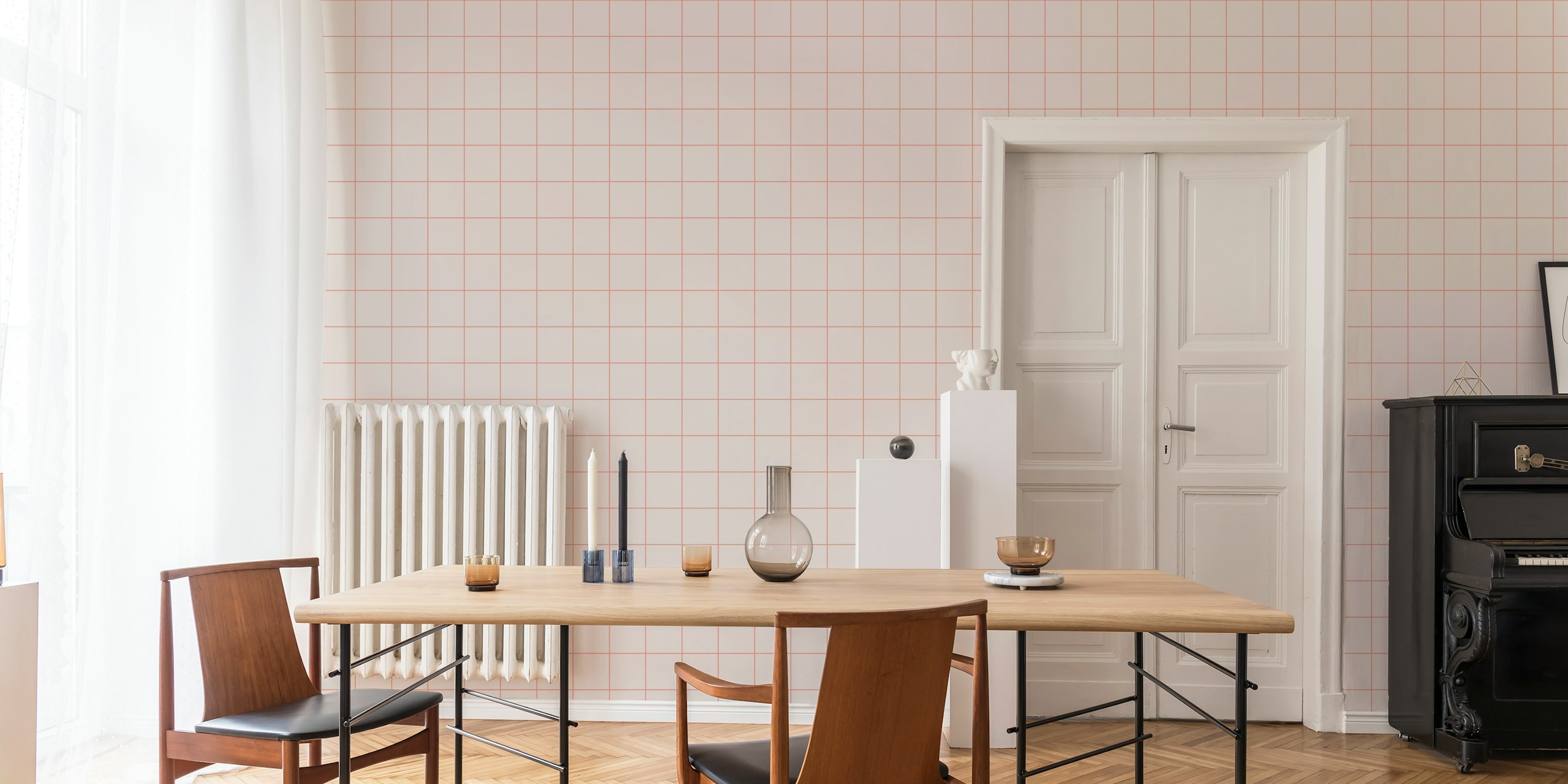 Soft pink and coral faux-tile grid wallpaper in a minimalist living room