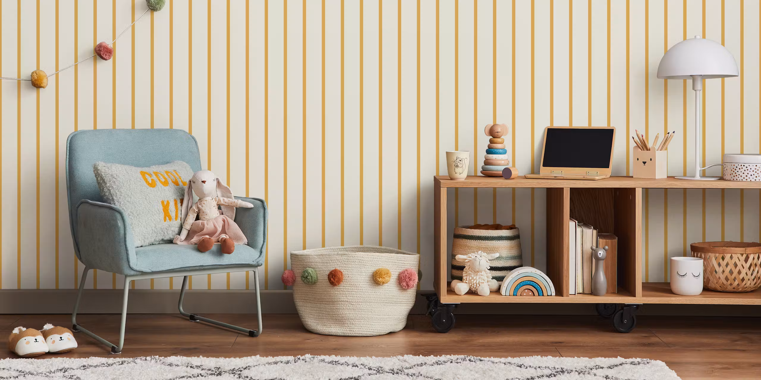 Vertical stripe wallpaper in beige and yellow in a Scandinavian nursery